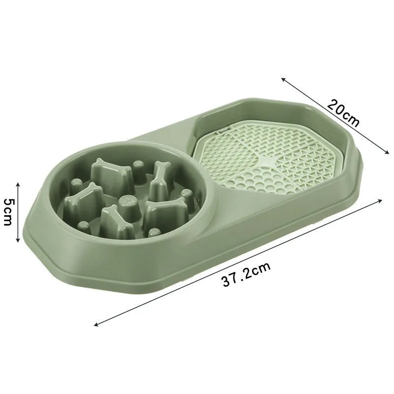 Blue interactive slow feeder dog bowl with maze pattern and non-slip base on a kitchen floor.