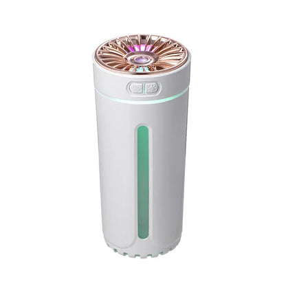 Black wireless car humidifier with colourful LED lights shown in vehicle cup holder