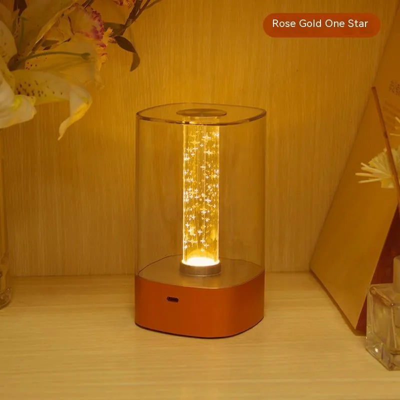 Rose Gold LED touch atmosphere lamp with abstract pattern on bedside table