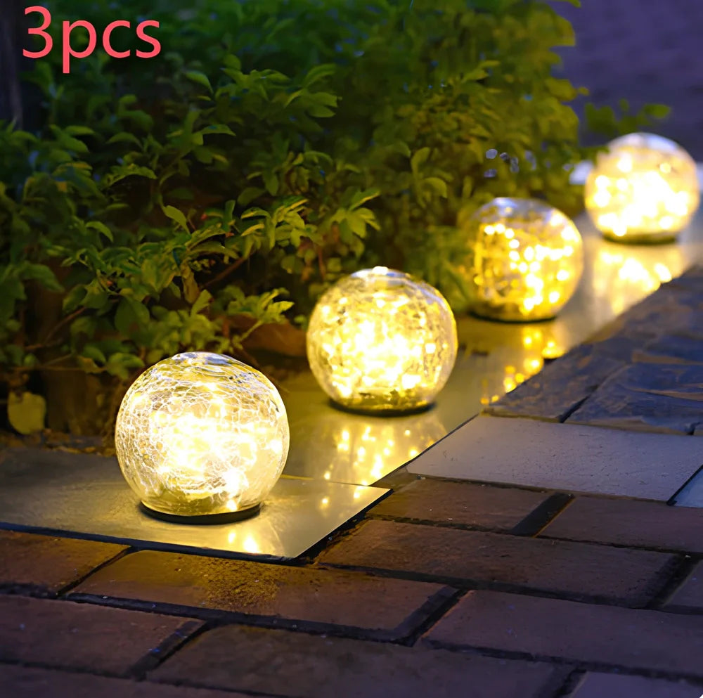 Cracked glass ball LED solar light, 10cm size with warm white glow for garden paths, waterproof and ground stake included