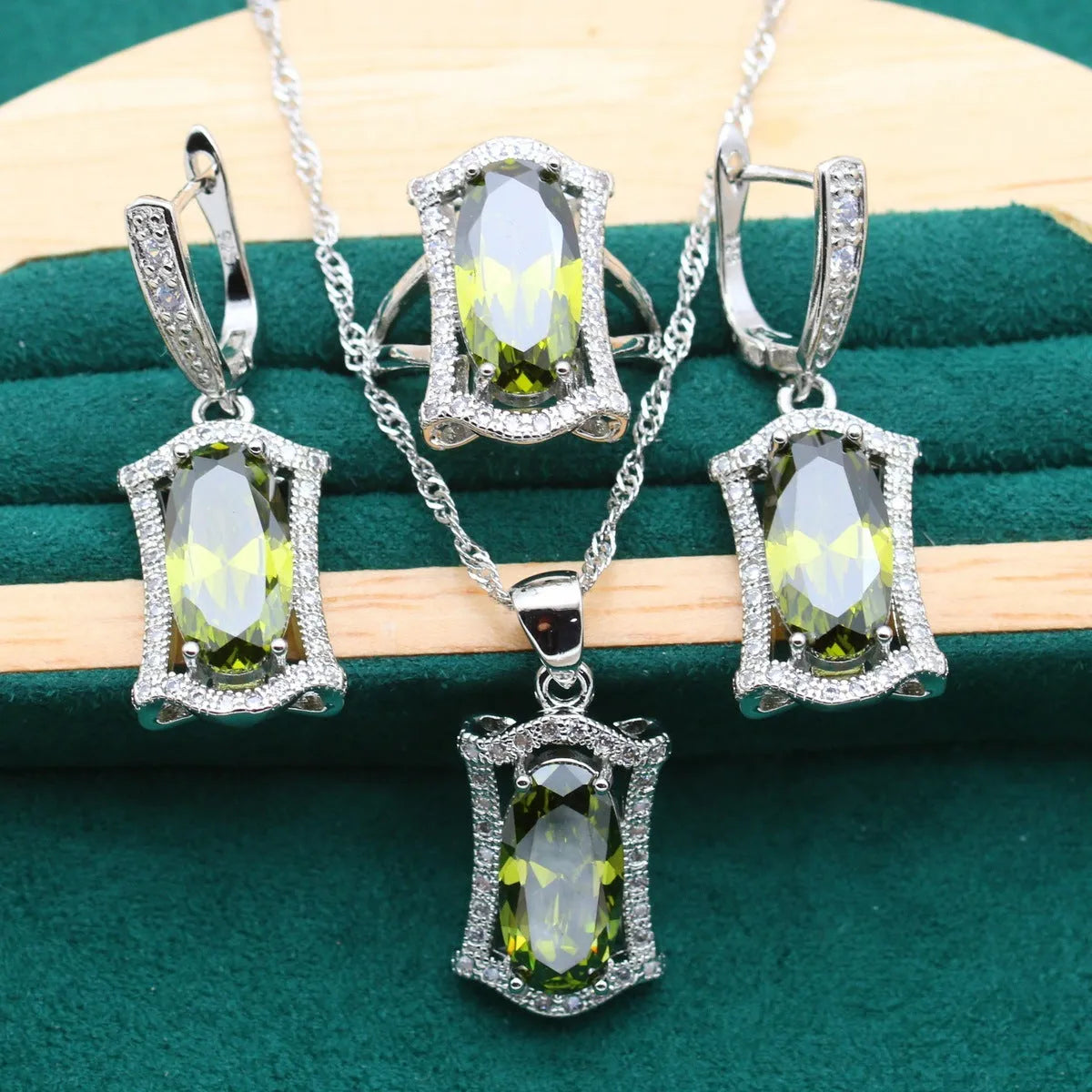 Women's yellow and olive alloy zircon jewellery set with necklace, earrings, ring, and bracelet on a snake bone chain.