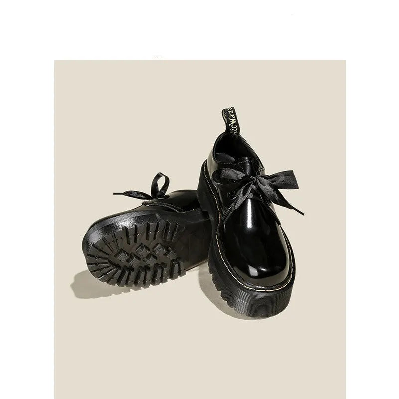 Women's black and white thick-soled leather shoes with cross-strap design and TPR tendon soles