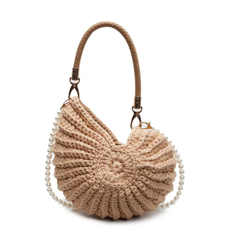 Handmade woven cloth bag with double shoulder straps in shell shape showing open pocket design