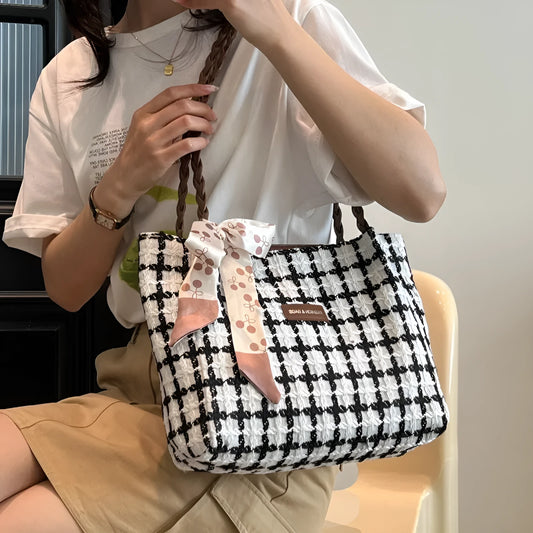 Horizontal square wool shoulder bag in black with sandwich pocket and internal organisation compartments