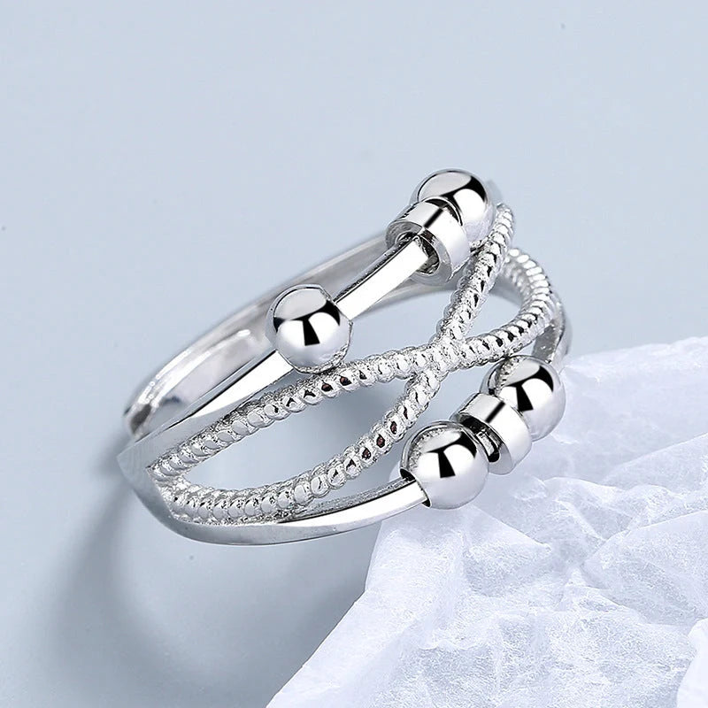 Adjustable rotatable anxiety relief ring for women with open design and platinum finish