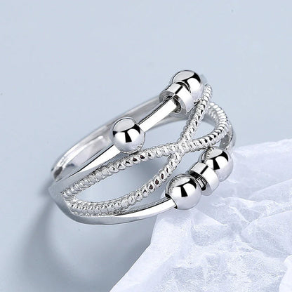Adjustable rotatable anxiety relief ring for women with open design and platinum finish