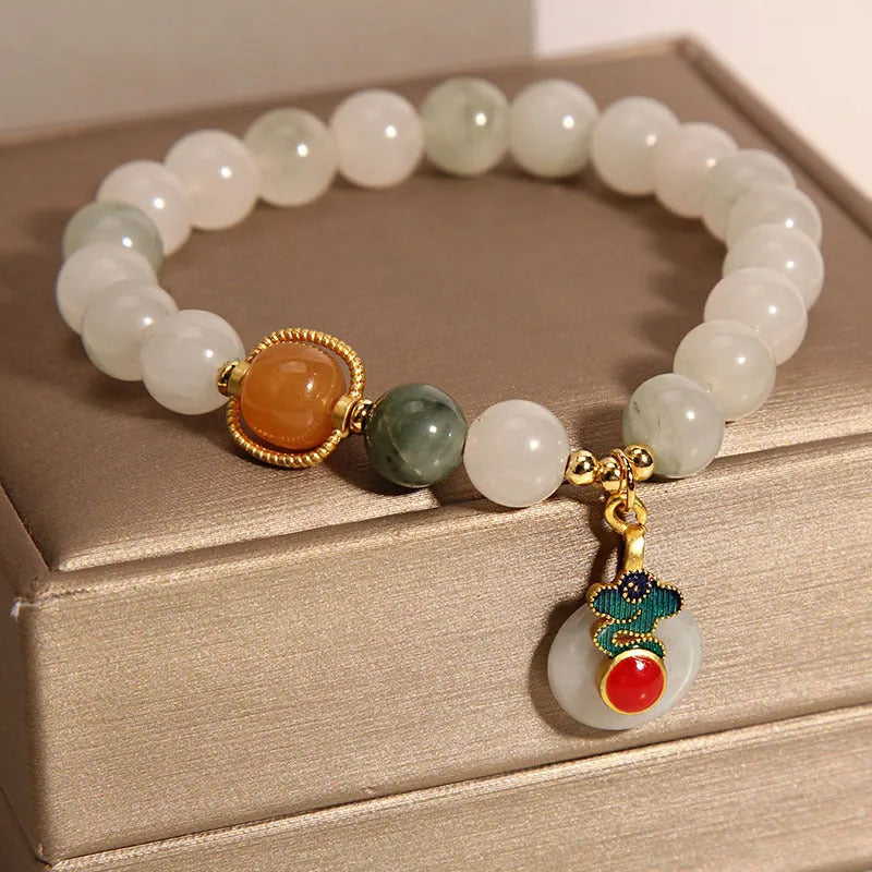 Ice jade crystal bracelet for women with Xiangyun peace jade buckle and pearl accents.