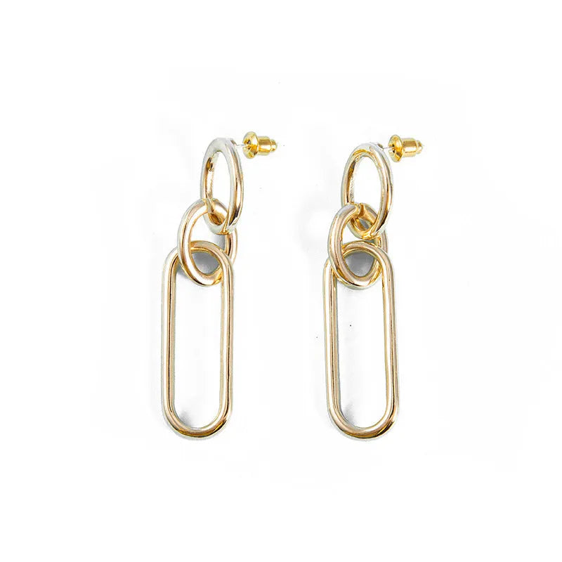 Geometric sterling silver needle finish hoop earrings showing ring and line design elements