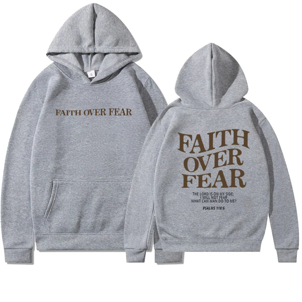 A stylish Christian hoodie with inspirational graphics and a message of faith over fear