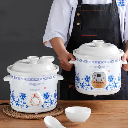 White porcelain electric stew pot with 22cm width and 1.5L capacity for automatic slow cooking