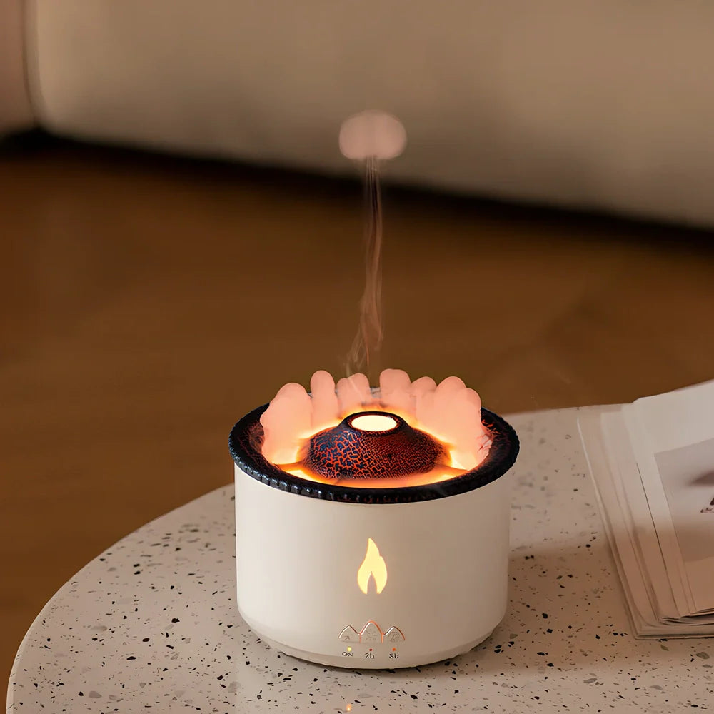 White volcano-shaped humidifier diffuser with flame lighting effect and remote control on wooden surface