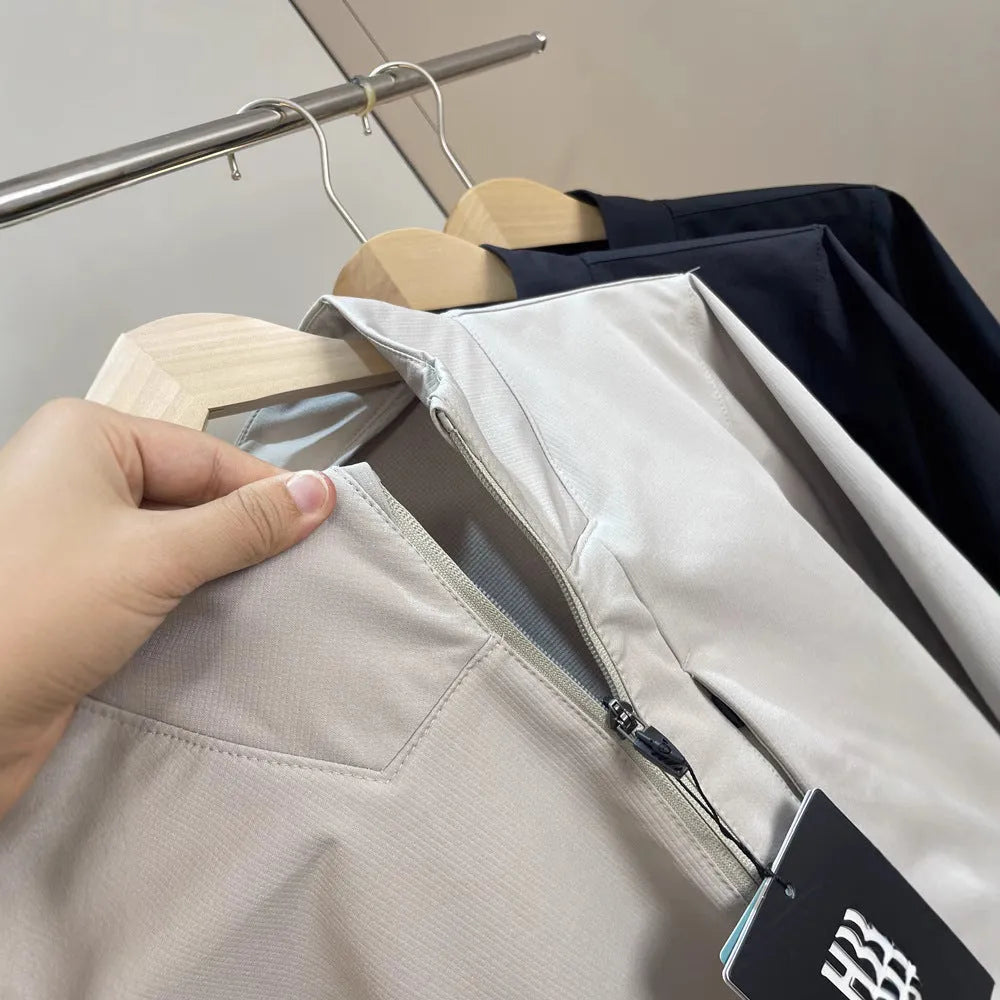 Men's stand collar casual jacket in polyester, shown in a neutral colour with straight hem and long sleeves.