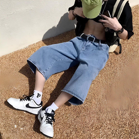 Men's blue washed denim shorts with high waist, cropped length, straight leg, and zipper fly