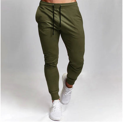 Men's cotton skinny sports trousers with drawstring and belt, available in five solid colours