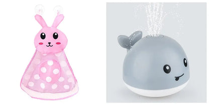 Automatic water-spraying whale bath toy with colourful lights floating in bath water.