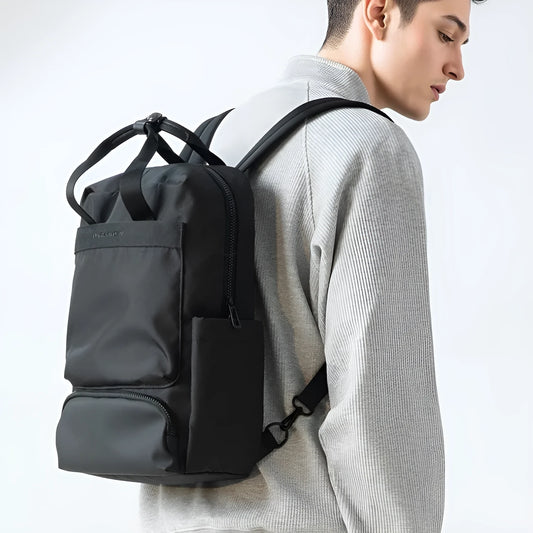Elegant black Oxford cloth computer backpack with a 20-35 litre capacity.