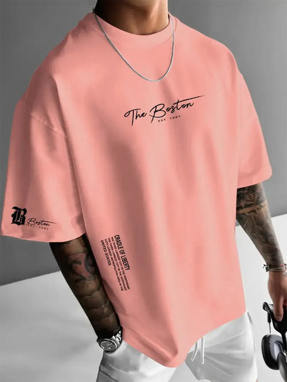 Men's round neck loose letter short sleeve T-shirt in polyester, shown in white, black, coral, and apricot