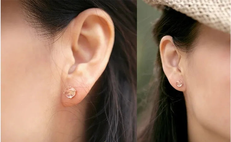 Women's drop-shaped stud earrings with synthetic rose quartz inlay and rose gold plating.