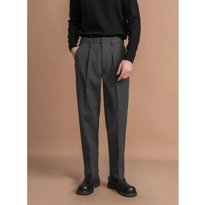 Man wearing straight cut draped polyester casual trousers in dark grey