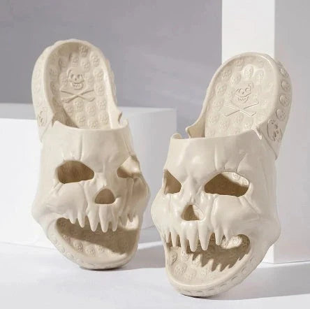Spooky skull-printed slide sandals in various colors and sizes