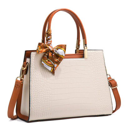 Milky white women's large shoulder handbag with interior organiser pockets and horizontal square shape.