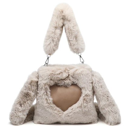 Plush tote bag for women in various colors, including black, brown, white, gray, and pink, with a soft, fluffy exterior and a spacious, versatile design.