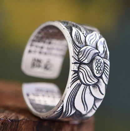 Handcrafted Thai sterling silver ring with intricate Heart Sutra engraving, promoting mental clarity and emotional balance.