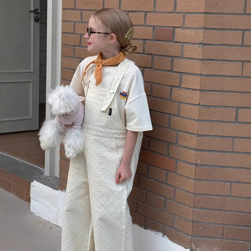 Polka dot overalls for girls in a Western style, designed for all-matching versatility with a high-waist trouser cut and available in milky white across seven height sizes from 90cm to 150cm to ensure a precise fit for various ages.