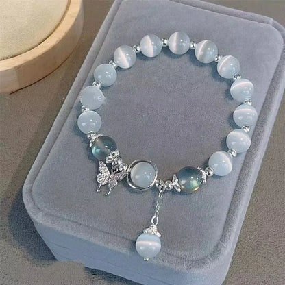 Handmade glass butterfly bracelet with drop-shaped beads in moonlight grey colour variation