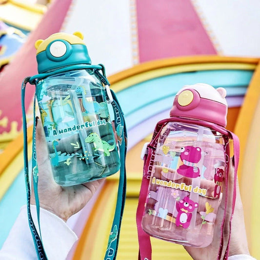 Red children's water cup with shoulder strap showing cartoon pattern and suction nozzle