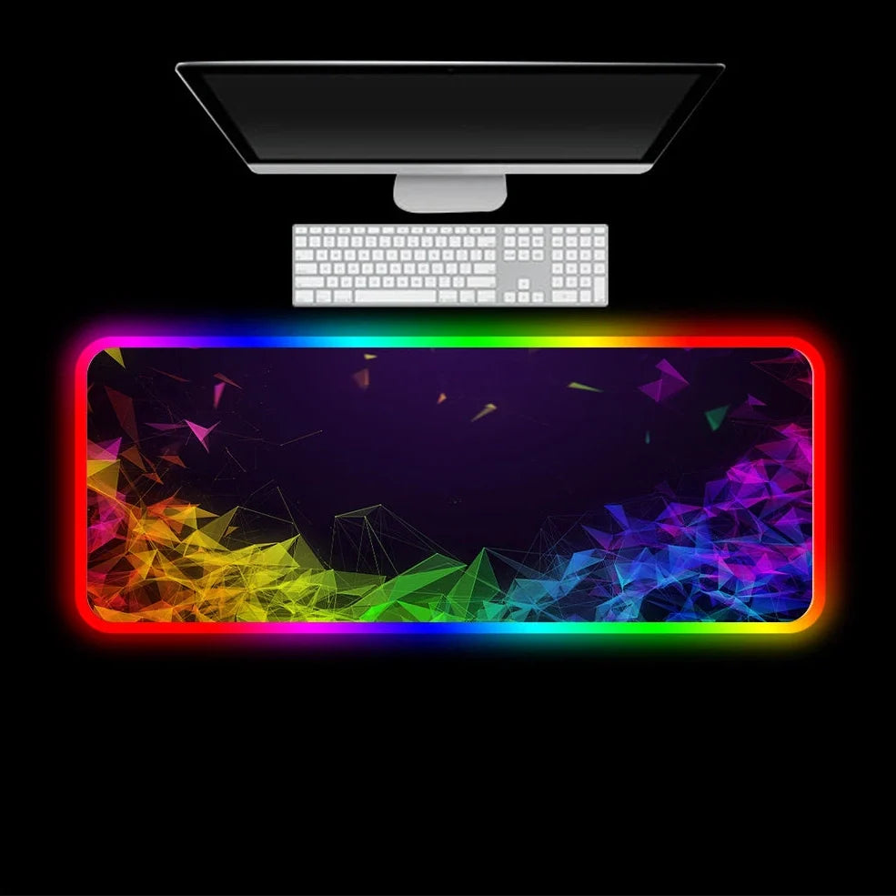 Black RGB gaming mouse pad with illuminated surface measuring 900x400mm and 4mm thickness