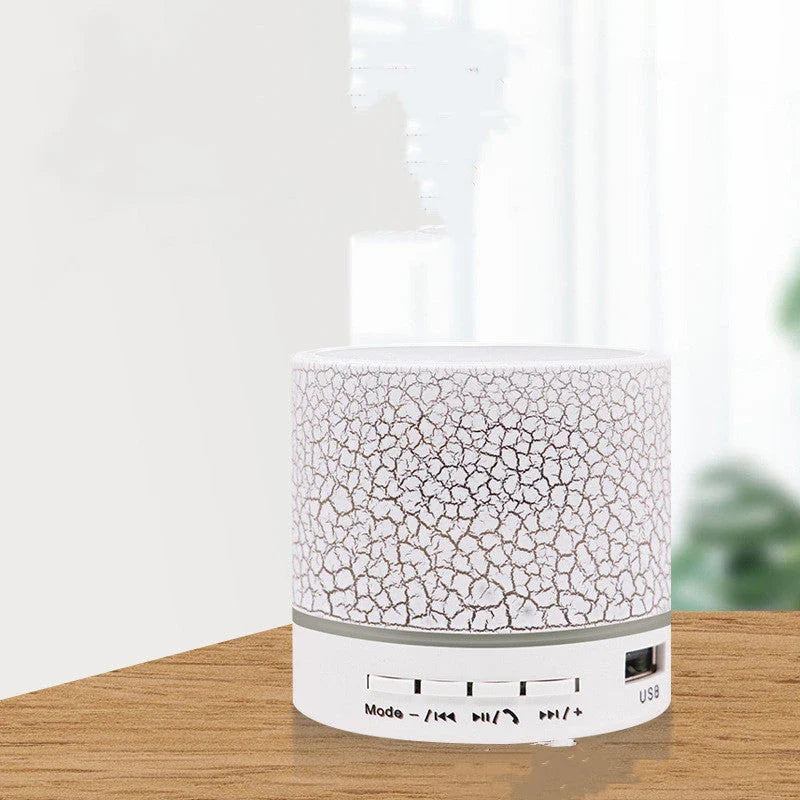 Portable Bluetooth speaker with colorful LED lights, offering impressive sound quality and convenient features for on-the-go music enjoyment.