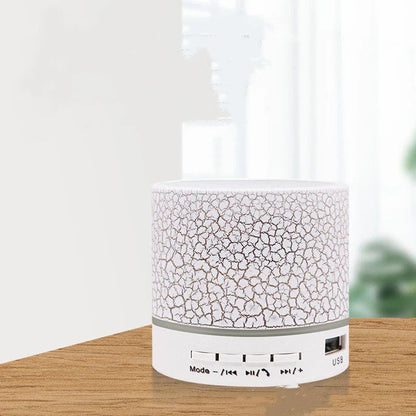 Portable Bluetooth speaker with colorful LED lights, offering impressive sound quality and convenient features for on-the-go music enjoyment.