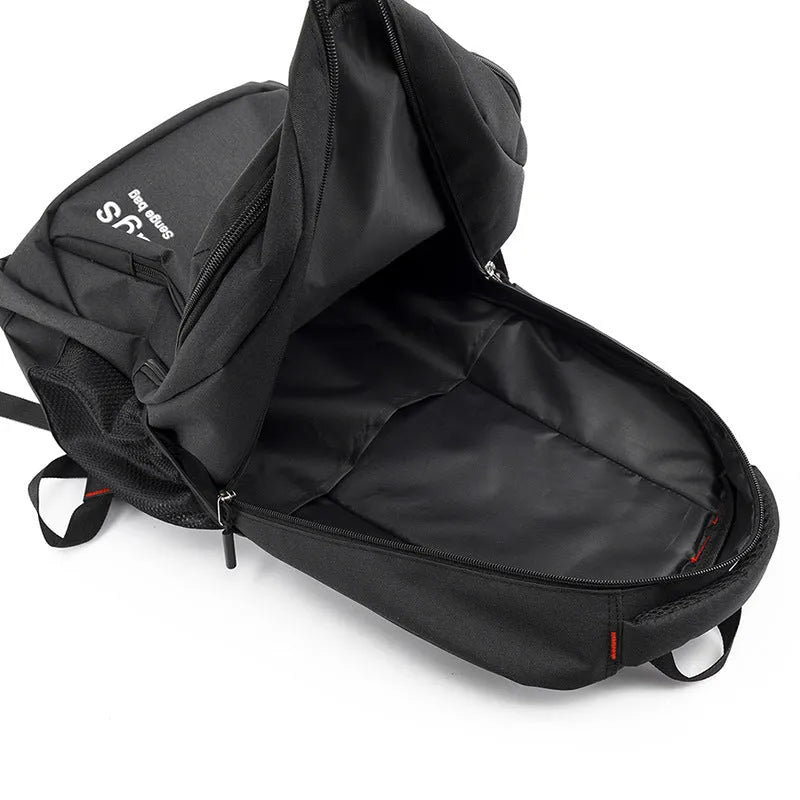 Black nylon street-style backpack with double shoulder straps, shown with open compartment revealing internal laptop sleeve and pockets.