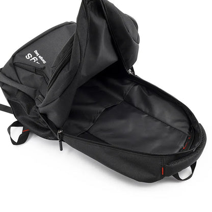 Black nylon street-style backpack with double shoulder straps, shown with open compartment revealing internal laptop sleeve and pockets.