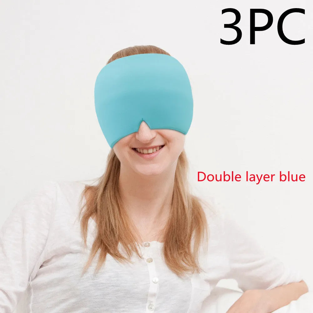 Black elastic gel headache relief mask laid flat showing eye contours and adjustable headband.