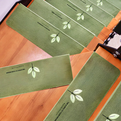 Self-adhesive luminous stair mat with glow strips on wooden staircase, rectangular design with hemmed edges