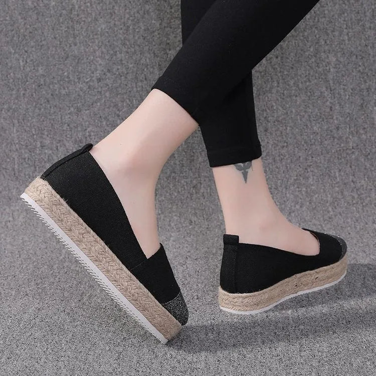 Breathable canvas slip-on flat shoes in black and white colours on a size chart showing 35 to 43.