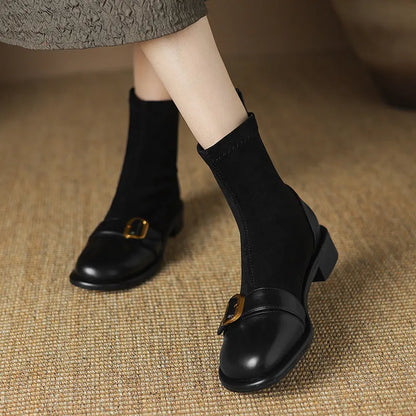 Women's black casual Martin boots with low heel, lace-up front, and decorative belt buckle stitching.