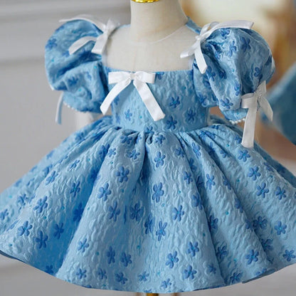 Blue polyester girls' princess dress with pettiskirt layering, shown in princess style for birthday occasions