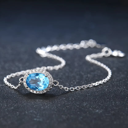 925 sterling silver jewellery set with blue topaz gemstones in geometry pattern, including earrings, ring, pendant, and necklace