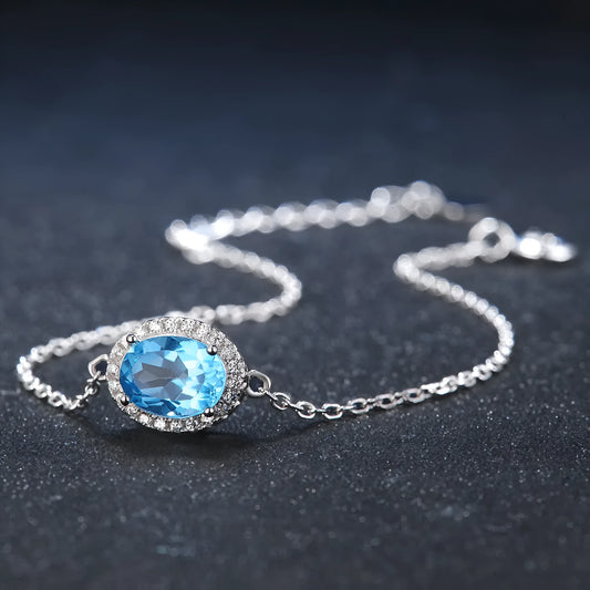 925 sterling silver jewellery set with blue topaz gemstones in geometry pattern, including earrings, ring, pendant, and necklace