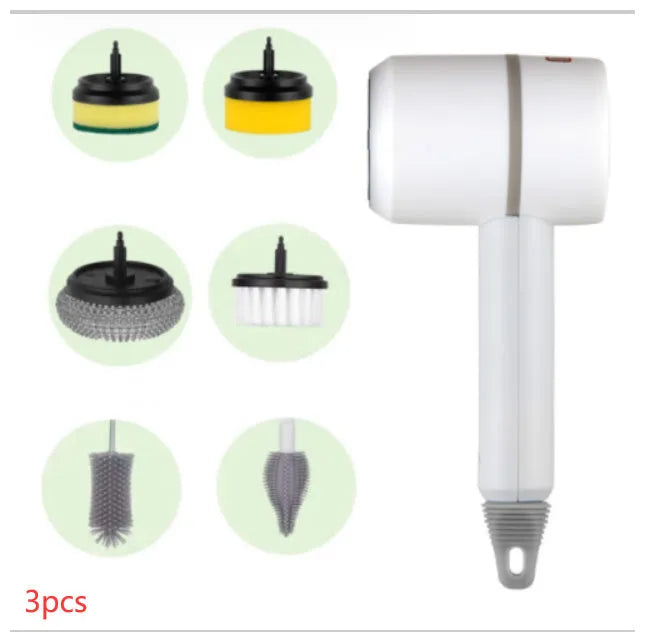 Green electric cleaning brush with scouring pad and brush heads on a kitchen worktop.
