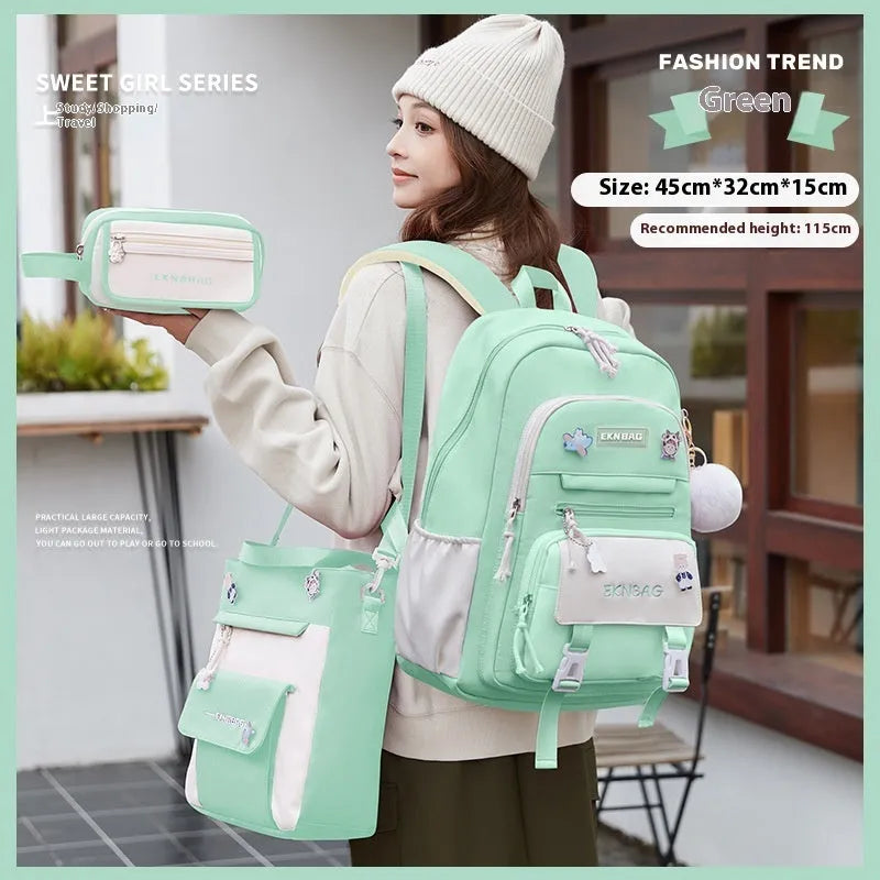 Pink waterproof Oxford cloth school backpack for girls with curved shoulder straps, shown with matching pencil case.