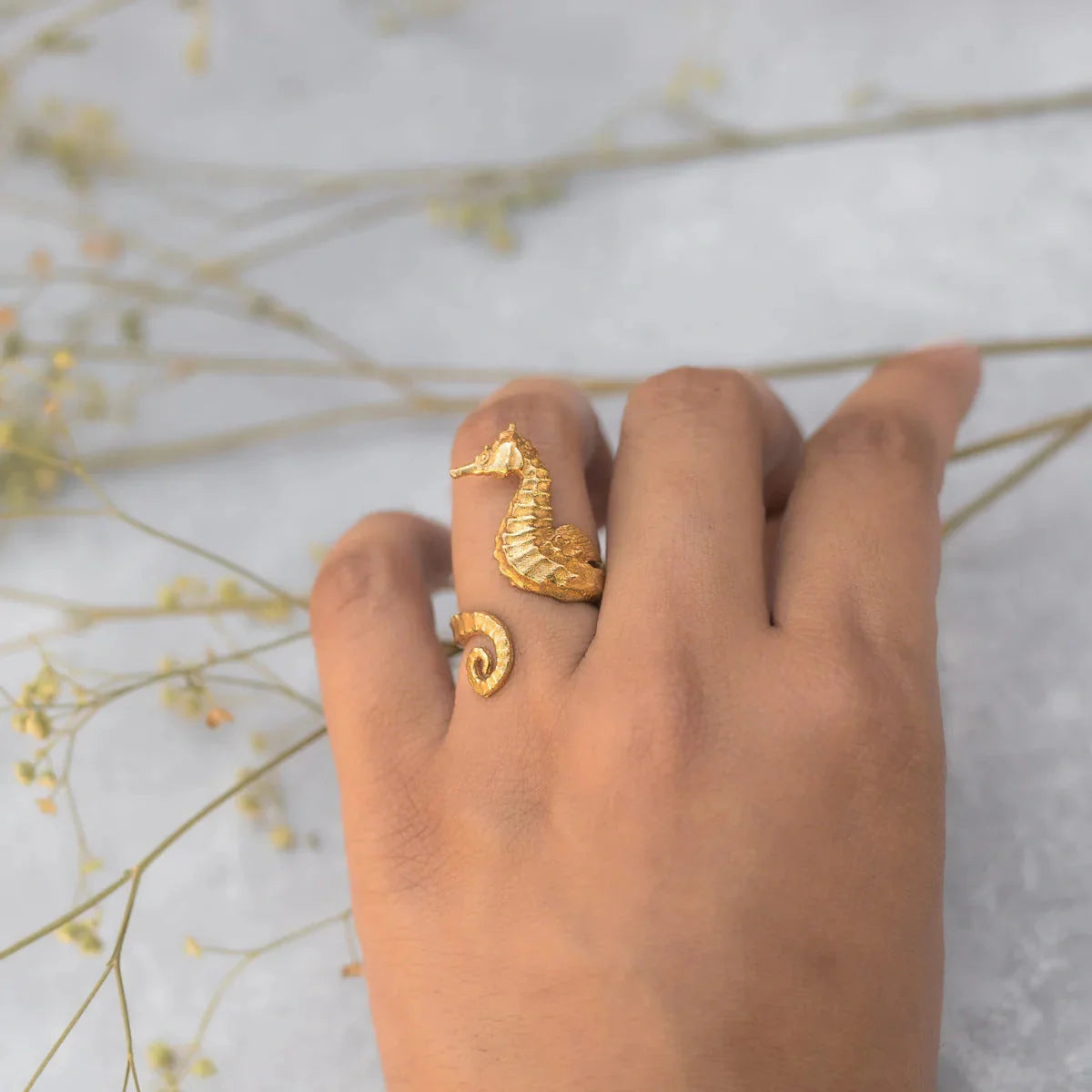 Shimmering 18K gold stainless steel cocktail ring with intricate seahorse design