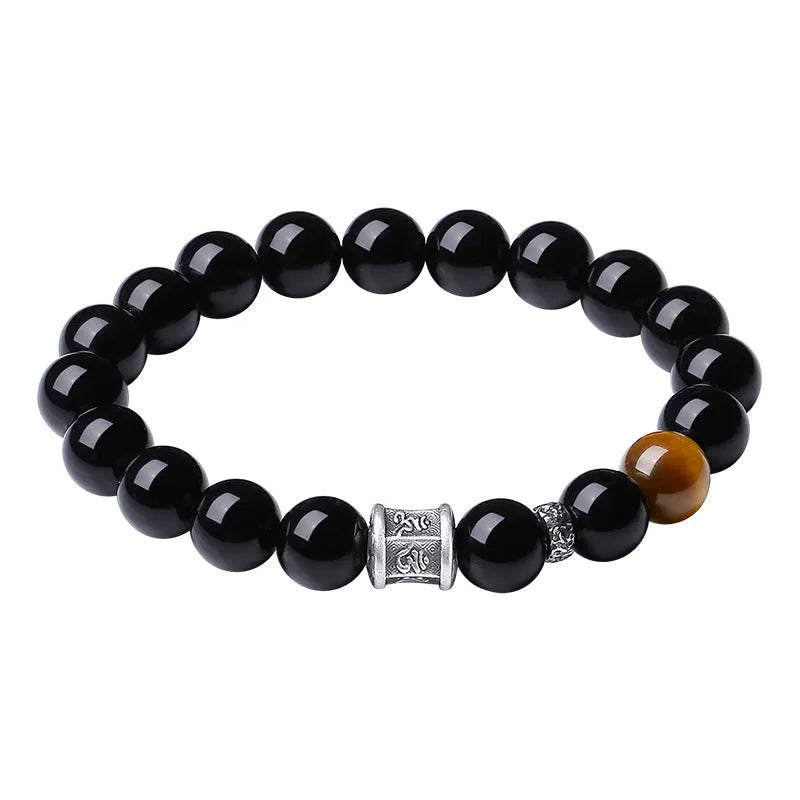 Men's black obsidian prayer wheel bracelet with hand-woven construction and 10mm beads
