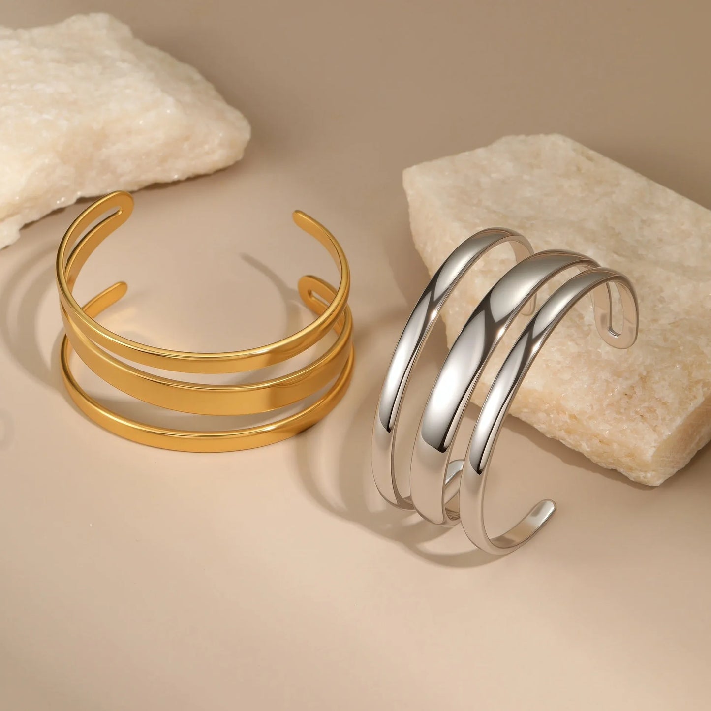 Women's stainless steel bracelet with geometric line design and simple opening clasp in gold electroplated finish
