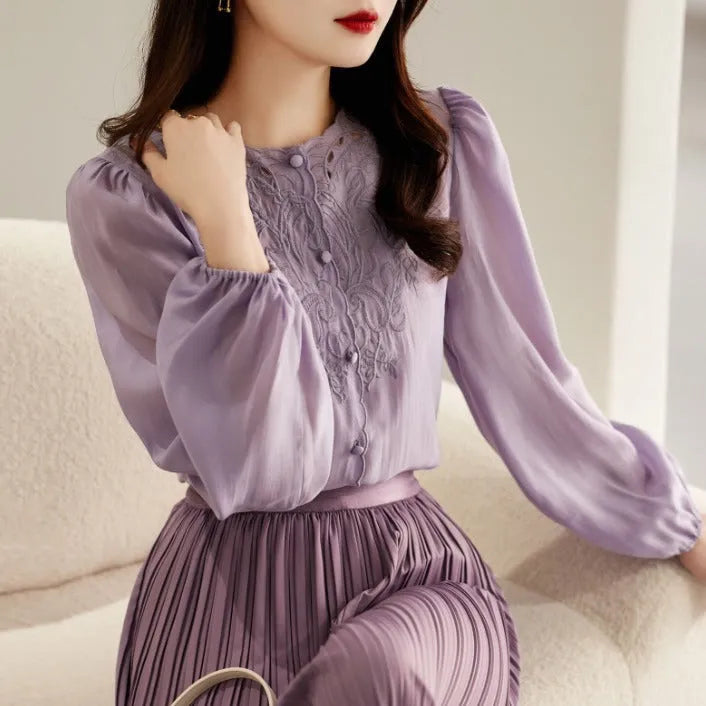 Round neck long sleeve shirt with lantern sleeves and geometric 3D pattern in purple, white, or black, sizes S to 2XL.