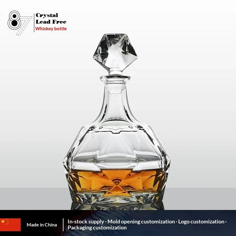 Hand-cut Bohemian crystal whiskey decanter with retro design and tapered pouring neck on wooden bar