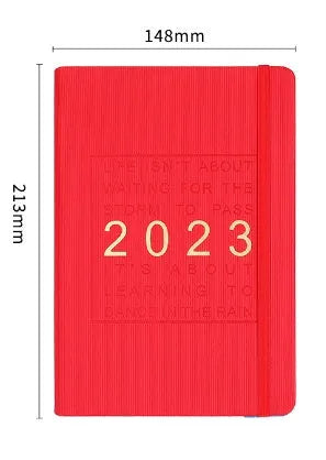 Creative student almanac diary with imitation leather cover open on a calendar page.